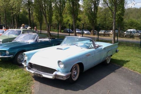 1991 Ford LTD Crown Victoria - Two classic Ford convertibles, a 1957 Thunderbird and a 1967 Mustang, are parked side-by-side.