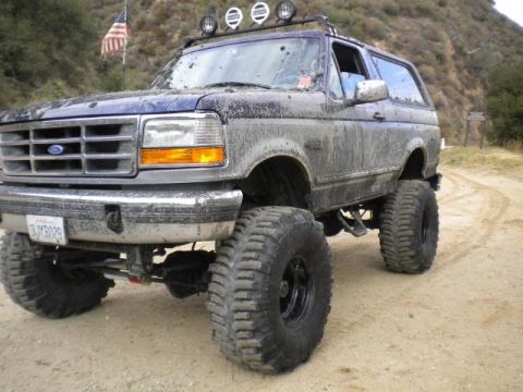 1994 Ford Bronco - This 1994 Ford Bronco is equipped for off-road adventures, covered in mud after a trail ride.