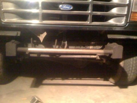 1994 Ford Bronco - Close-up of the front grille and suspension components of a Ford Bronco, identified as a 1992 model year.