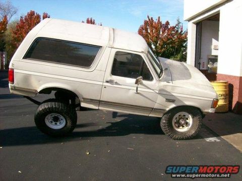 1994 Ford Bronco - This lifted 1994 Ford Bronco features oversized tires and a modified suspension, giving it a distinctive stance.