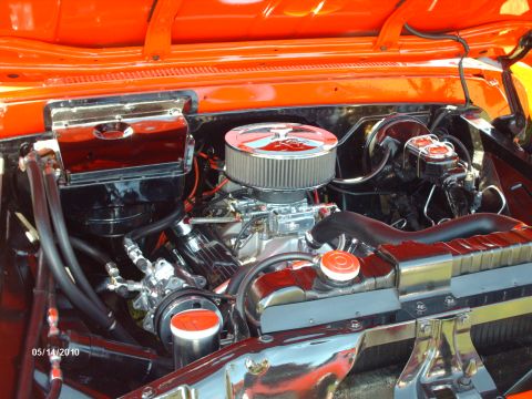 Engine bay with chrome air cleaner and orange painted firewall