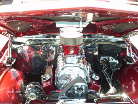1992 Ford Bronco - Customized engine bay features a prominent supercharger and polished components.