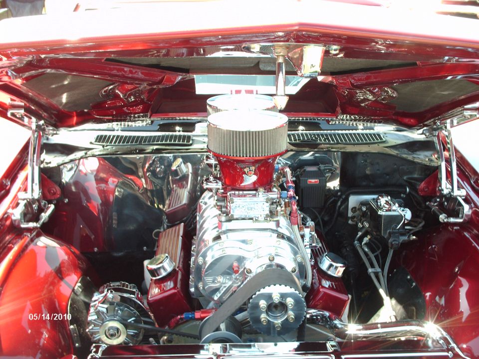 Engine bay with polished supercharger and red accents