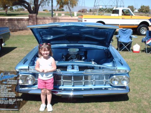 1992 Ford Bronco - A young girl stands before a classic 1959 Chevrolet El Camino at a car show.
