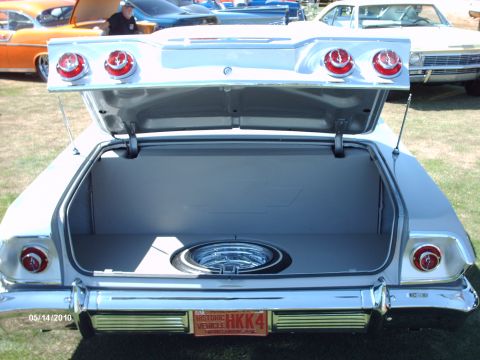 1992 Ford Bronco - Silver 1962 Chevy Impala convertible trunk open at a car show, triple round taillights, historic plate HKK4.