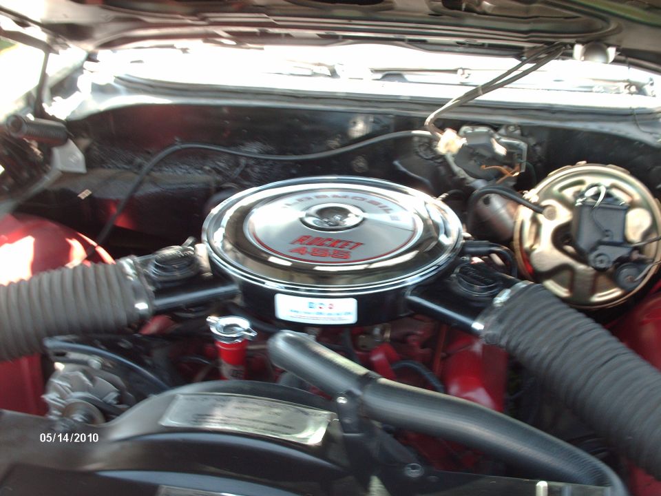 Engine bay with a chrome air cleaner labeled "Rocket 455" and a brake booster