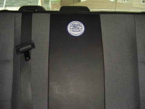 2003 Ford Crown Victoria - Emblem on the seat back reads 'Ford Police Vehicles'.