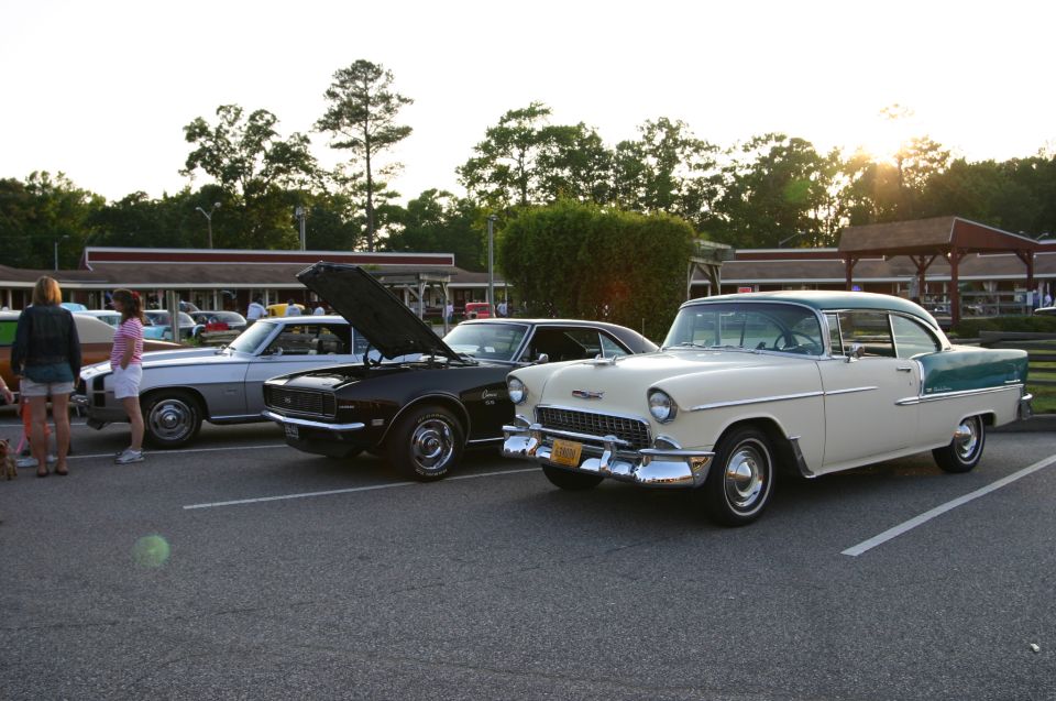 Cream and teal 1955 Chevrolet Bel Air parked at a car show