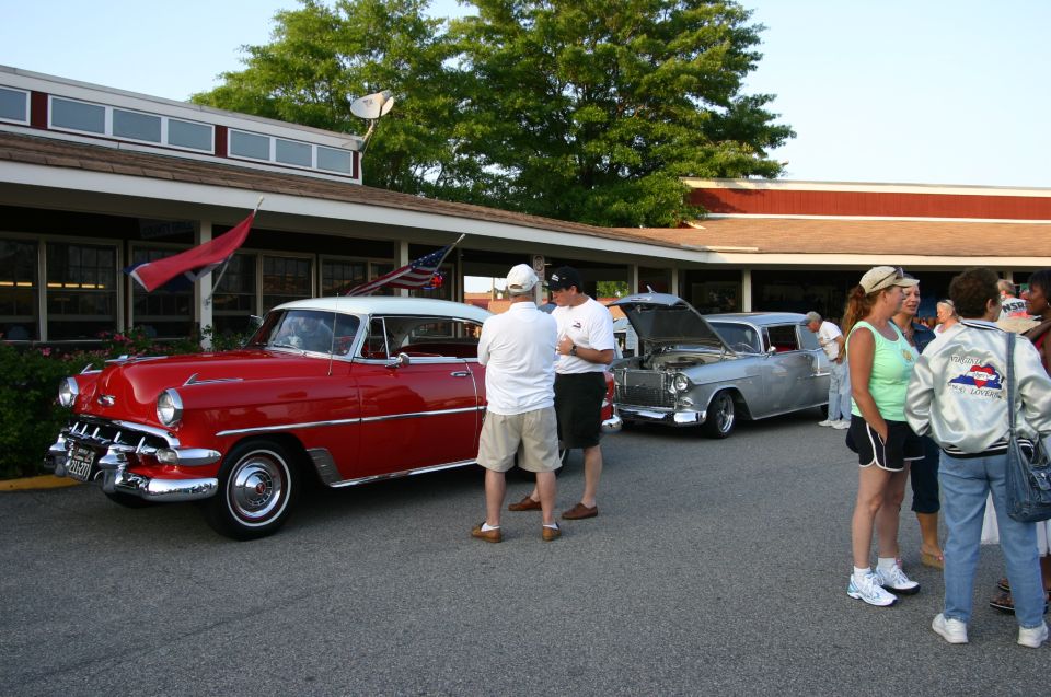 Red and white 1954 Chevrolet Bel Air hardtop, front 3/4 view