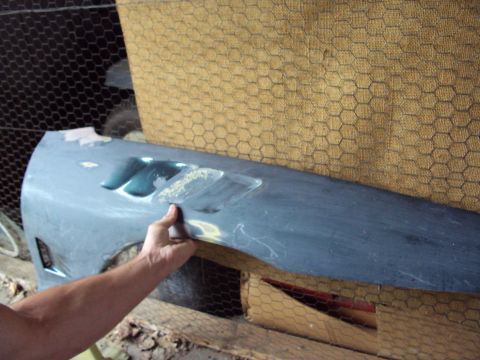 1993 Ford Probe - Car fender undergoing bodywork and preparation for paint.
