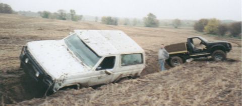 1980 Ford Bronco - Not good when both trucks get stuck in the slippery ditch