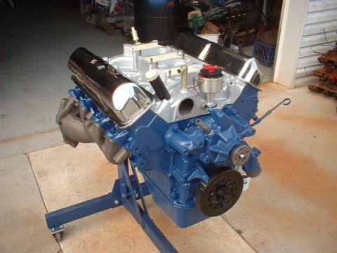 1969 Ford Torino - Blue V8 engine on a stand, ready for installation or rebuild.