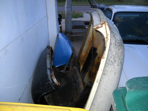 1954 Ford F-100 - Assorted vintage car body panels are stored together, some showing signs of rust and wear.