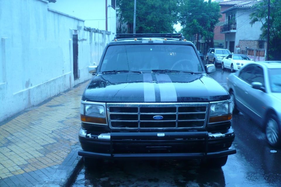Black 1992 Ford Bronco front view with grey racing stripes