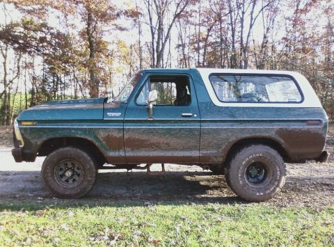 1979 Ford Bronco - This classic Ford Bronco is shown from the side, with a two-tone paint scheme and off-road tires.