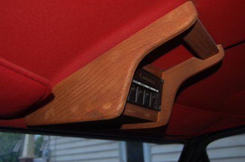 1988 Ford Bronco - Overhead console with wood trim and Centurion climate controls visible inside the vehicle.