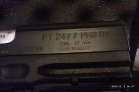 2000 Mercury Grand Marquis - The slide of a Taurus PT 24/7 PRO DS pistol is visible, marked with its model, caliber, and country of origin.