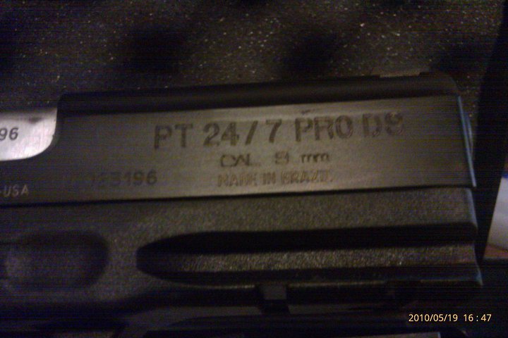 Close-up of a Taurus PT 24/7 PRO DS pistol slide, showing caliber 9mm and "Made in Brazil"