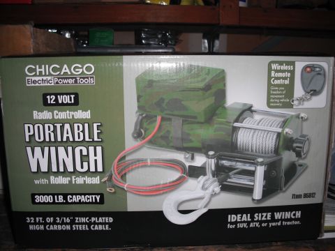 1991 Ford Bronco - The box displays a camouflage-covered portable winch with a wireless remote control and 32 ft. of cable.
