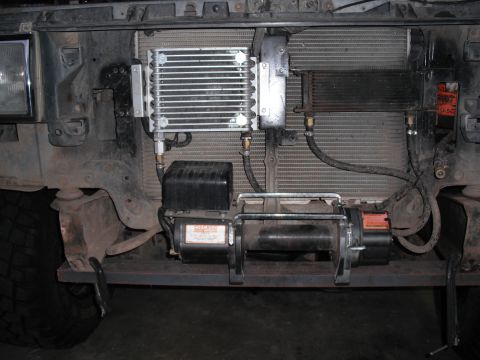 1991 Ford Bronco - A winch is installed in front of the vehicle's radiator and oil cooler assembly.