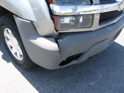 1991 Ford LTD Crown Victoria - Front bumper and headlight show significant damage from an impact.