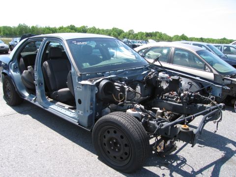 1991 Ford LTD Crown Victoria - This 1991 Ford Crown Victoria LTD is missing its front end and body panels, revealing its chassis and interior.