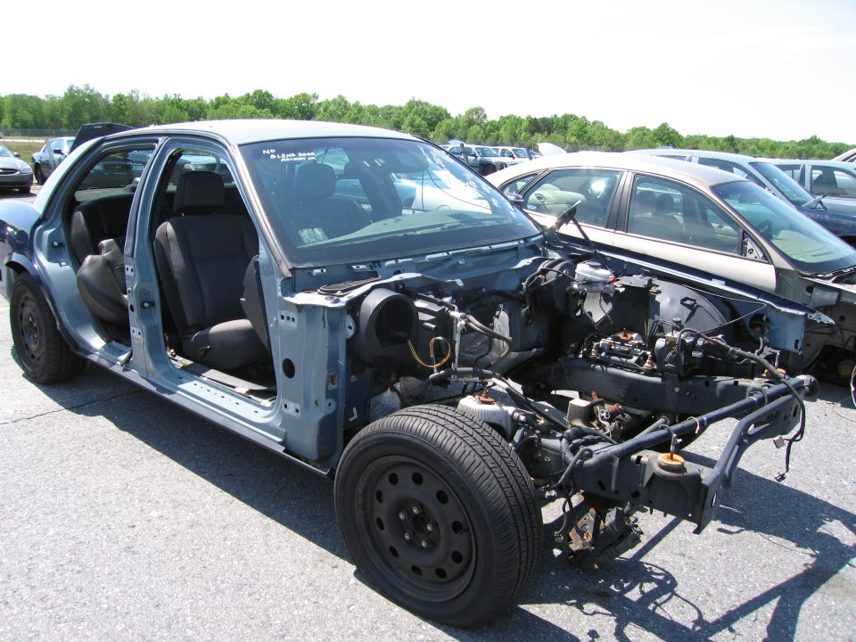 1991 Ford Crown Victoria LTD chassis, blue, front view, stripped of most body panels and engine