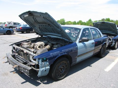 1991 Ford LTD Crown Victoria - This 1991 Ford Crown Victoria LTD police car is shown with its hood open, revealing the engine compartment.
