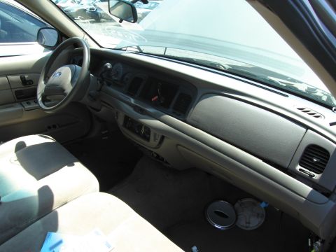 1991 Ford LTD Crown Victoria - The interior of a Ford Crown Victoria shows the dashboard, steering wheel, and front seats.