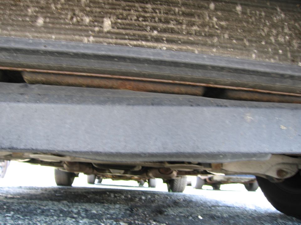 Underside view of a car showing the frame and suspension components