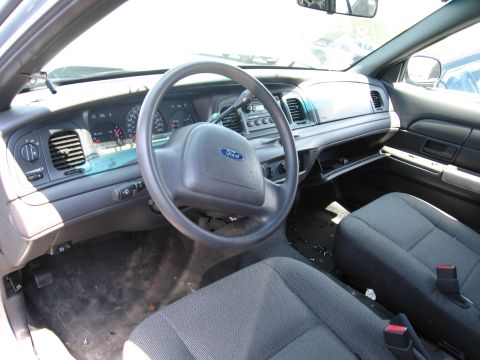 1991 Ford LTD Crown Victoria - Interior view of a Ford vehicle, showing the steering wheel, dashboard, and seats.