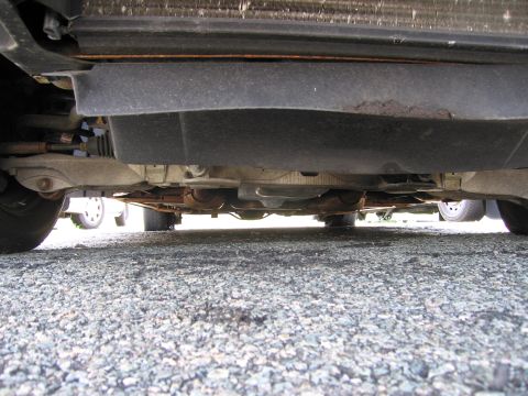 1991 Ford LTD Crown Victoria - Underside view of a vehicle, revealing suspension and exhaust systems.
