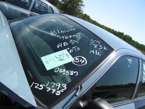 1991 Ford LTD Crown Victoria - Notes on the windshield indicate mechanical issues and mileage, but no year is visible.
