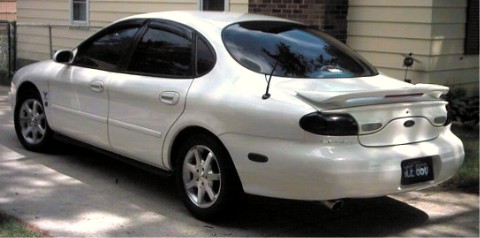 1997 Ford Taurus - This 1997 Ford Taurus sedan is shown from the rear 3/4 angle, parked in a driveway.