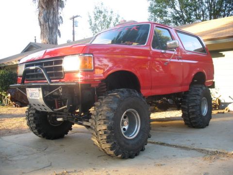 1969 Ford F-250 - This lifted Ford Bronco features large off-road tires and a custom front bumper.