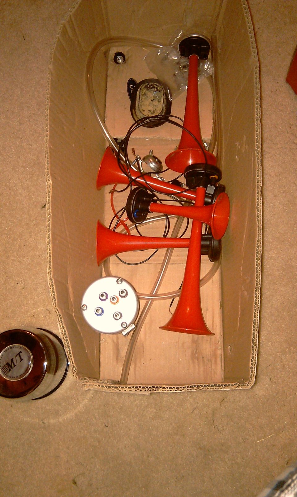 Red air horn kit with chrome knob labeled M/T