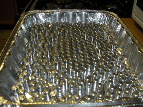1996 Ford Bronco - Rows of metal valve lifters are organized in a foil pan, likely for cleaning or preparation.