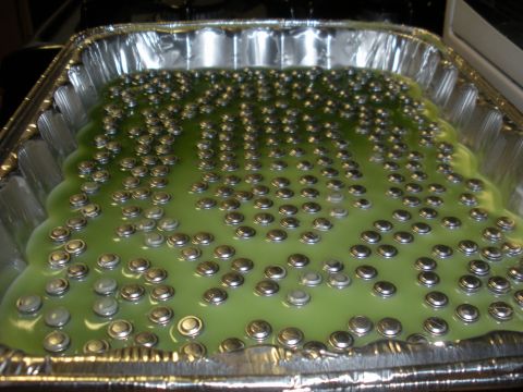 1996 Ford Bronco - Bullets are being cast in a pan filled with green liquid.