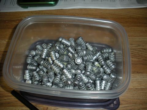 1996 Ford Bronco - A clear container holds a large quantity of silver bullets, suggesting a reloading or casting activity.
