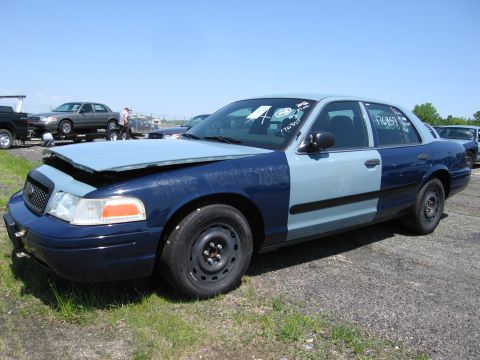 1991 Ford LTD Crown Victoria - This 1991 Ford Crown Victoria LTD police car has a two-tone paint scheme with a light blue front and dark blue rear.