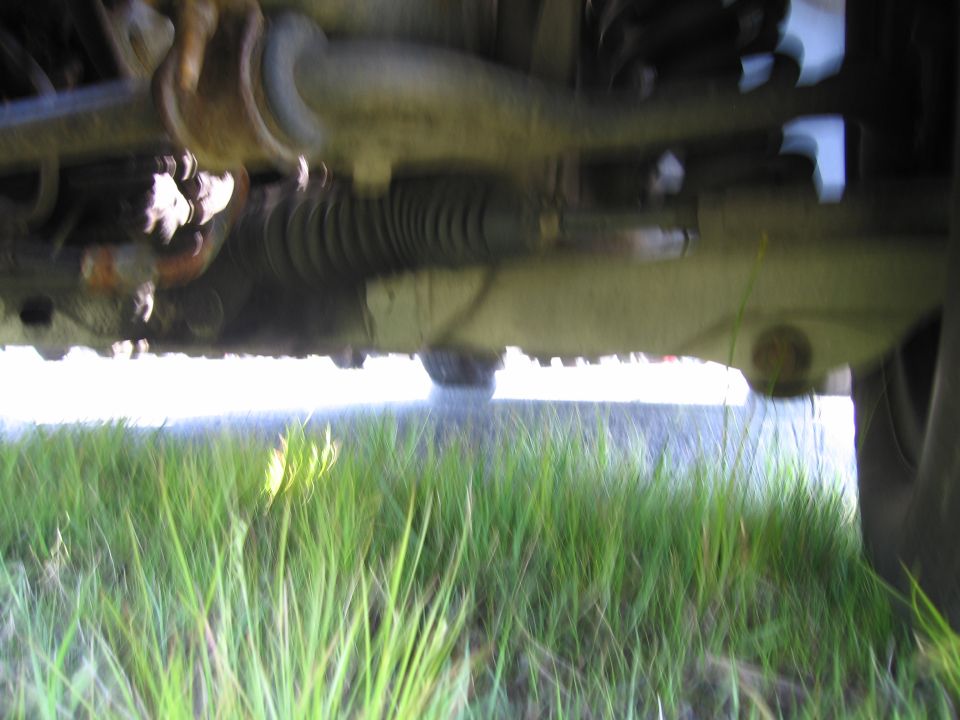 Underside view of vehicle steering components and suspension
