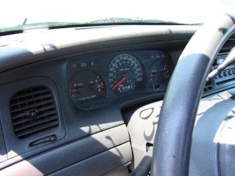 1991 Ford LTD Crown Victoria - Interior view of a vehicle's dashboard, showing the speedometer, fuel gauge, and air vent.