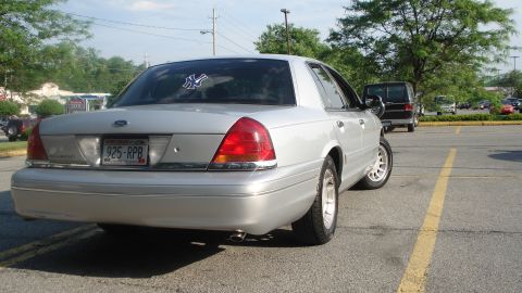 2000 Ford Crown Victoria - Rear view of a 2000 Ford Crown Victoria parked outdoors.