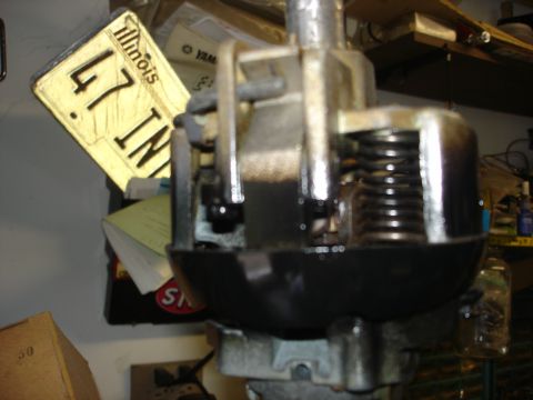 1979 Ford F-250 - A close-up view of a vehicle part with a yellow tag attached, showing some metal elements.