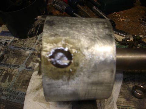 1979 Ford F-250 - A close-up view of a metal component with a hole in the center, possibly a part from a larger assembly.