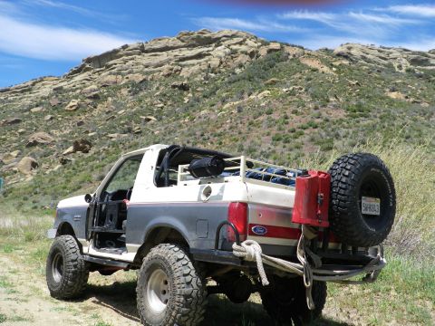 1991 Ford Bronco - This modified Ford Bronco is equipped for off-road adventures, a spare tire and extra fuel.