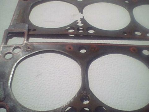 1972 Ford Ranchero - Close-up of a used head gasket, showing signs of wear and potential damage.