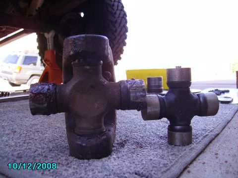 1978 Ford Bronco - Comparison of a worn universal joint with a new replacement part.