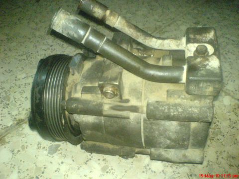 1998 Ford Crown Victoria - This is a car AC compressor, likely from a Ford Crown Victoria, but the year is not visible.