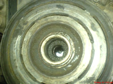1998 Ford Crown Victoria - This image shows a close-up of an A/C compressor clutch, a visible "010" marking, likely indicating a part number or manufacturing code.